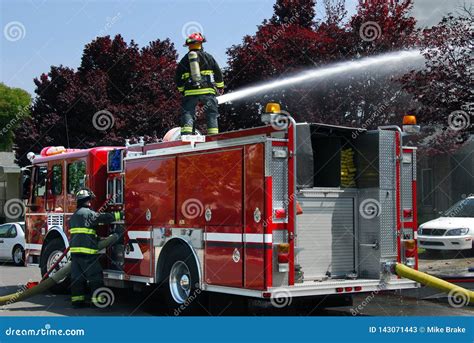 Firemen Using Water Canon on Fire Truck To Put Out Apartment Fire Stock Image - Image of ...