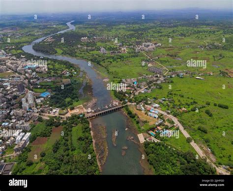 A bird's eye view of a river surrounded by green vegetation Stock Photo - Alamy