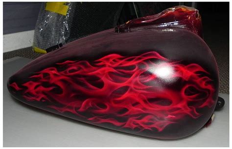 This is red kandy realistic flames painted on a Harley Davidson motorcycle tank by Taff Stephens ...