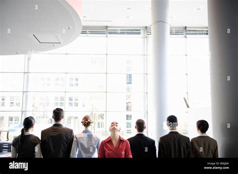 Business people standing in line Stock Photo - Alamy