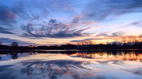 Beautiful sunset calm lake reflection in the water shore trees Sky ...