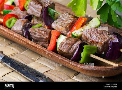 Brochettes of meat and vegetables, grilled on the barbecue Stock Photo ...