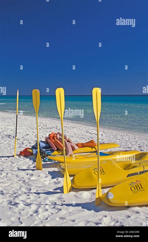 Beach bright colors yellow kayaks and paddles sport summer outdoor recreation florida fl gulf ...
