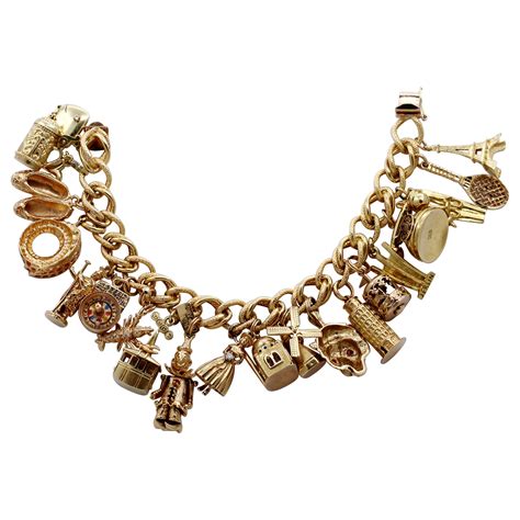 Gold Charm Bracelet with Eleven Charms with Assorted Stones at 1stDibs