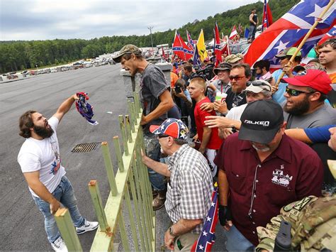 Tensions flare as Confederate flag supporter reaches for gun when confronted by protests – in ...