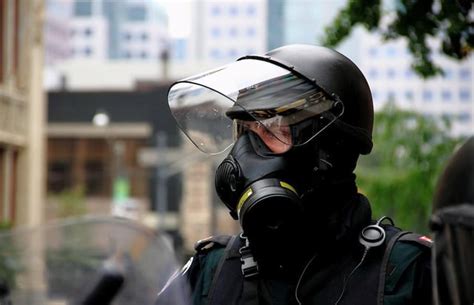 Canadian Riot Police officer, using the Avon C50 gas mask during ...