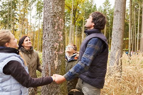 Religious Family with Children Praying in Front of a Tree Stock Photo ...