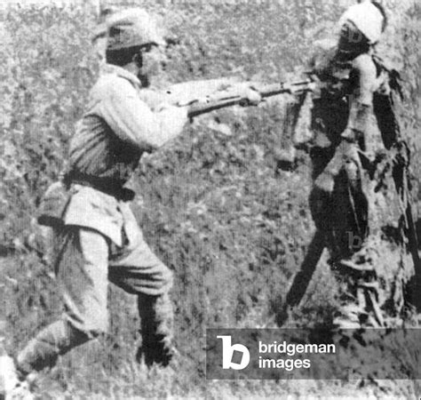 Image of China: Rape of Nanking - Japanese soldier bayoneting bound Chinese