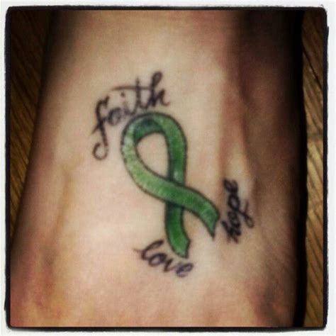 My tat for my mom! The lymphoma ribbon with faith, love and hope around it! Lymphoma Tattoo ...