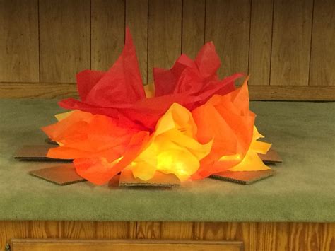 Fake fire for VBS. I used tissue paper and wedding lights for the glow ...