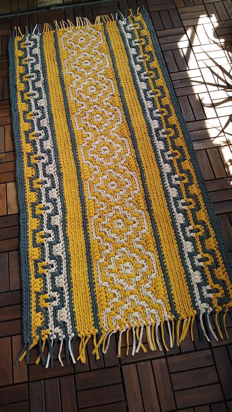 a yellow and blue rug on the floor