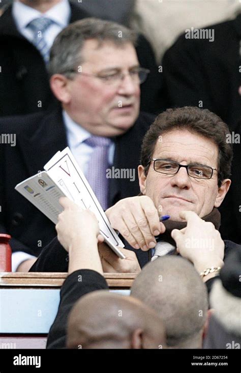 England manager Fabio Capello signs an autograph for a fan in the ...