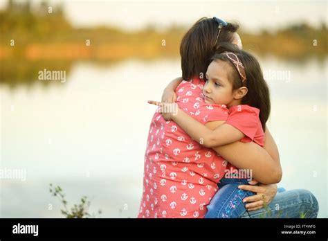 girl hugging her mother Stock Photo - Alamy