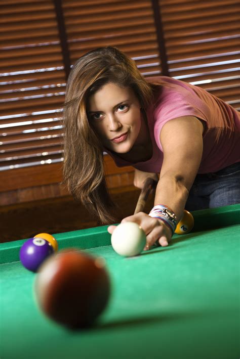 Young Woman Playing Billiards