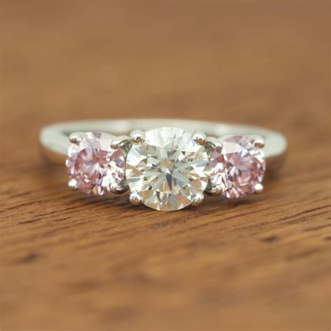 Pink Diamond and White Diamond 3 Stone Platinum Ring (wow!)