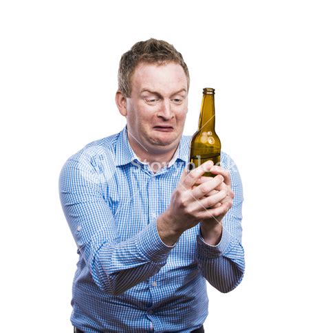 Humorous young man with a beverage. Studio shot on white background. Royalty-Free Stock Image ...