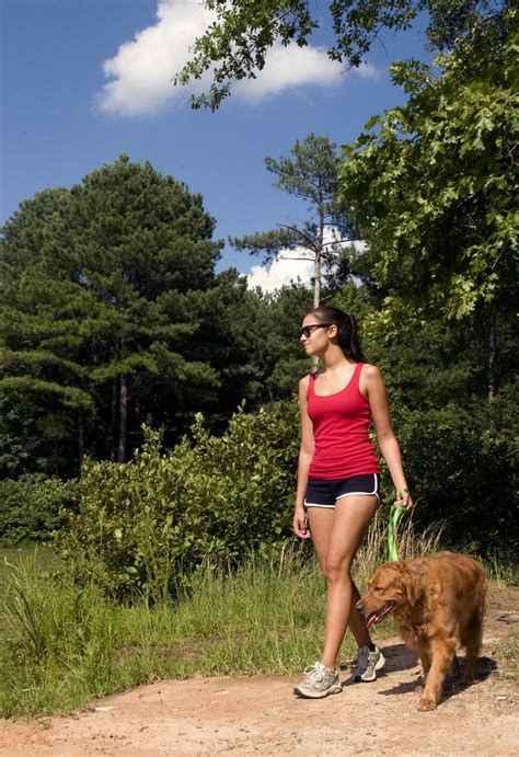 Dog Woman | Free Stock Photo | A young woman walking her dog outdoors | # 16359