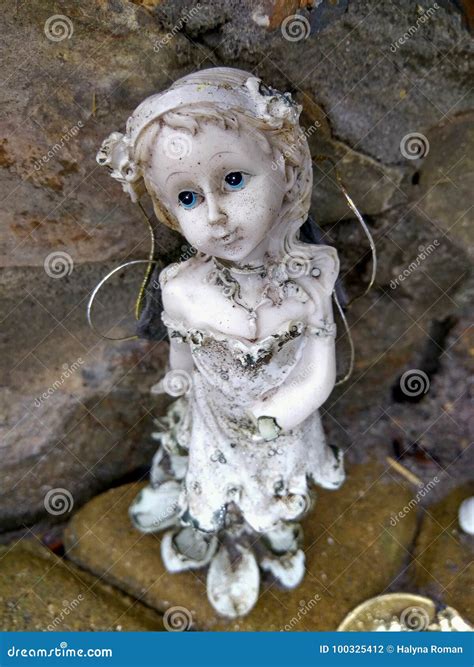 Old Broken Angel Statue with Blue Eyes Stock Photo - Image of sand, angel: 100325412