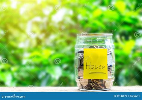 Coins in Jar and Stick Label that House on Wooden Stock Image - Image of donation, money: 94182579