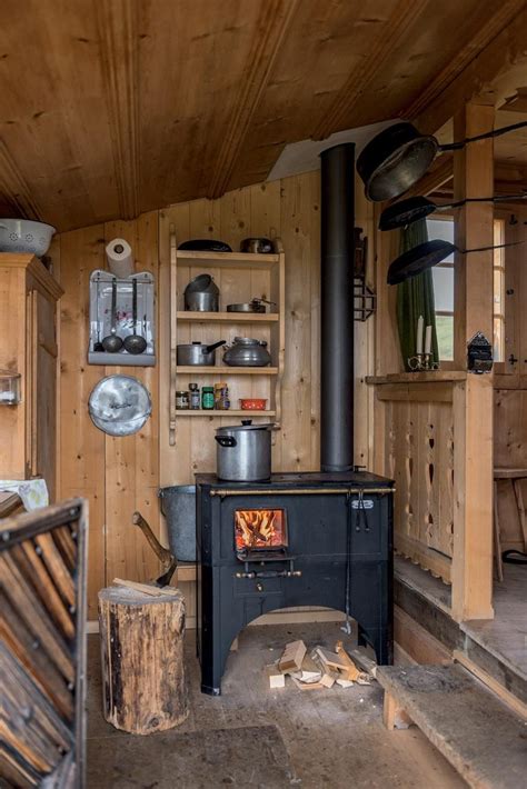 Pin on Hütte | Cabin interiors, Tiny house cabin, Wood burning stove