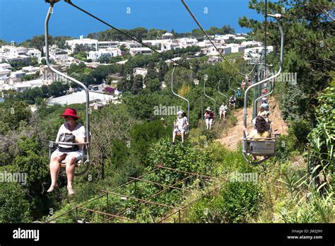 visitors taking the chairlift to the summit of monte solaro on the ...