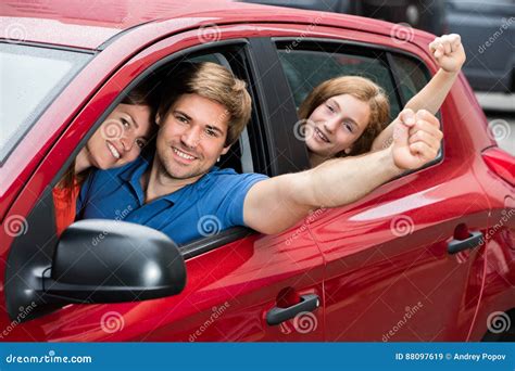 Family Sitting in Car Raising Their Arms Stock Image - Image of ...