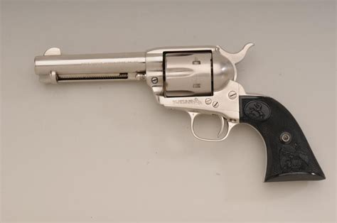 Colt SAA revolver, .44-40 cal., 4-3/4” barrel, brushed nickel finish, checkered eagle hard rubber