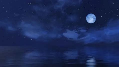 Full moon in starry night sky above calm... | Stock Video | Pond5