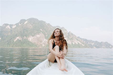 Woman relaxing on a canoe | Premium Photo - rawpixel