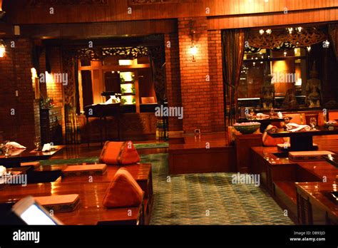 interior of traditional thai restaurant in Bangkok Sheraton hotel thailand table setting Stock ...