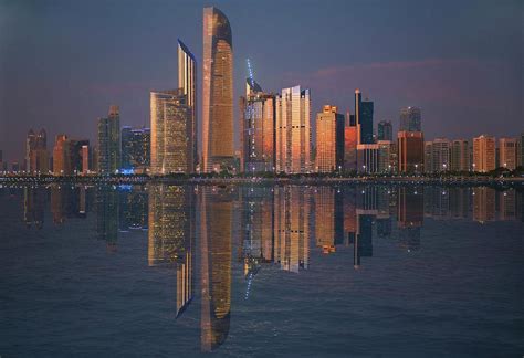 Abu Dhabi skyline night Photograph by Adrian Watkins - Fine Art America