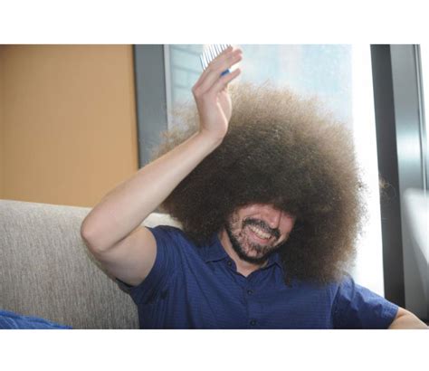 Man earns Guinness World Record for “Largest Male Afro” - Men's Journal