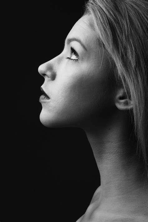 a black and white photo of a woman's profile with her eyes closed to ...