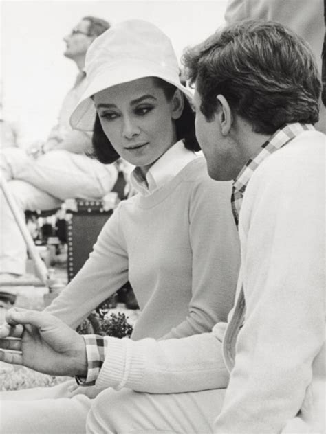 a man and woman sitting next to each other