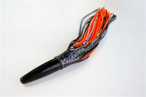 Wahoo Machine Lure 12 oz head double skirted Black/Orange - CatchAllTackle.com