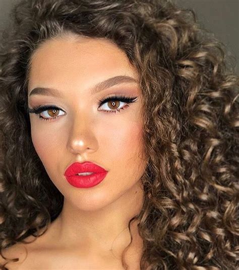 Soft brown cat eye makeup, red lips | Curly hair styles, Hair styles, Cat eye makeup