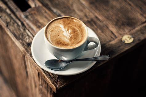 Cappuccino Coffee on Rustic Wooden Table Royalty-Free Stock Photo