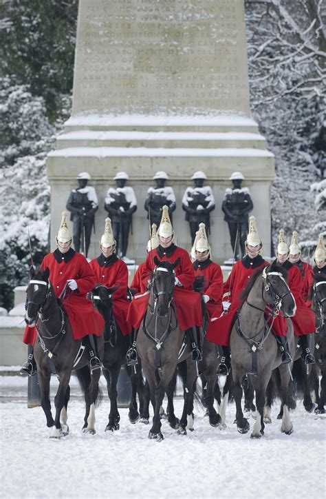 British Army feeling festive. The Life Guards riding on to Horse Guards Parade, in London, in ...