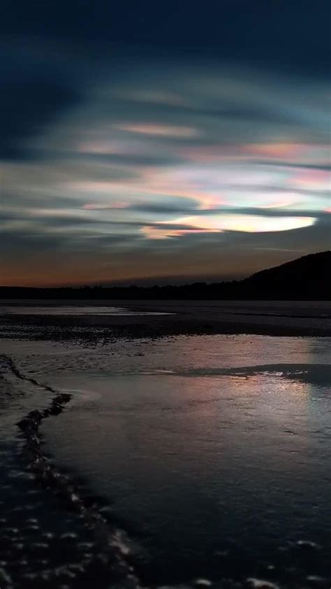 Polar Stratospheric Clouds Shine in Vivid Colors Over Lake in Sweden ...