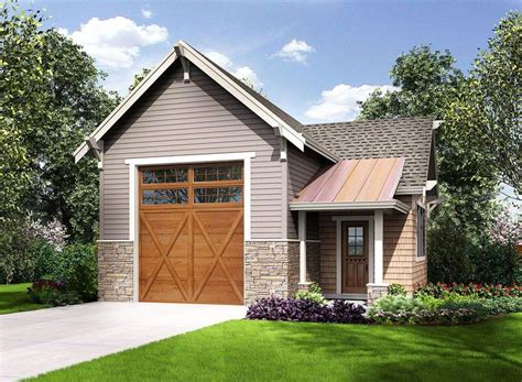 This beautiful Craftsman RV garage is loaded with style and good looks.Metal roofing tops the ...