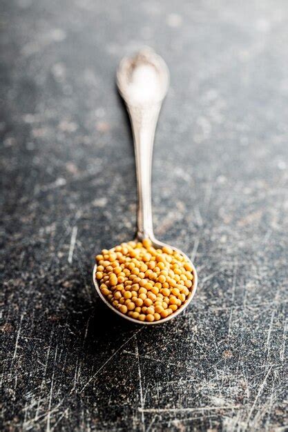 Premium Photo | Yellow mustard seeds