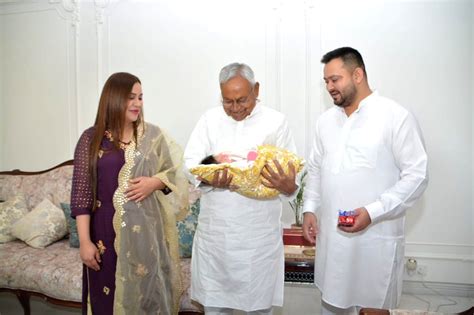 Patna : Bihar CM Nitish Kumar holds daughter of Tejashwi Yadav and ...