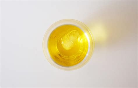 Premium Photo | Directly above view of liquor in glass on white background