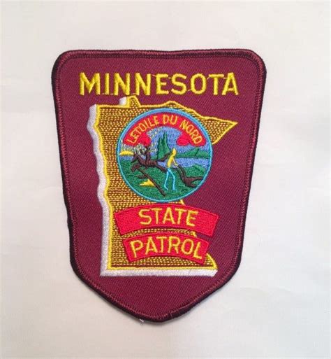 the minnesota state patrol badge is shown on a white background with ...