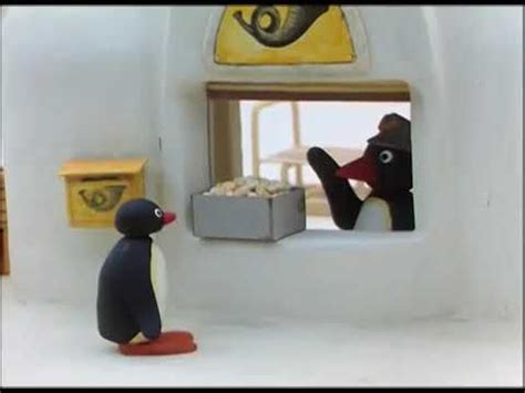 a toy penguin is looking out the window at another figurine standing in front of it