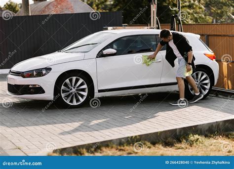 Man is Wiping the Car with a Microfiber Cloth. Stock Photo - Image of equipment, dirty: 266428040