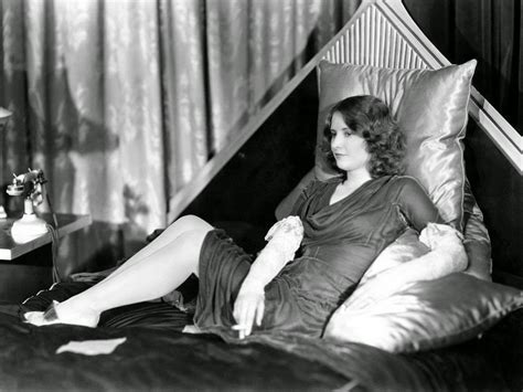 Film Noir Photos: Smoking in Bed: Barbara Stanwyck