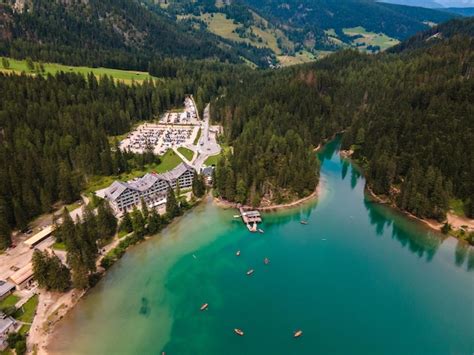 Premium Photo | Drone view of lake braies and the forest in the italian ...