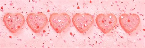 Premium Photo | Decorated heart shaped cookies on pink background