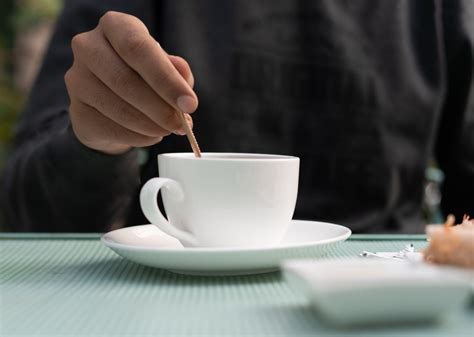 Boy mixing sugar in tea - PixaHive